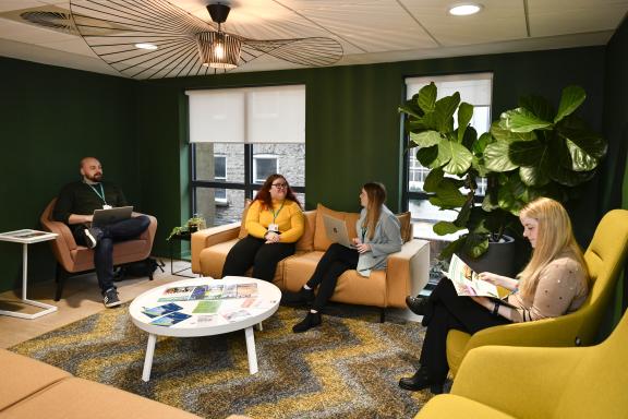 A group of colleagues working in the office