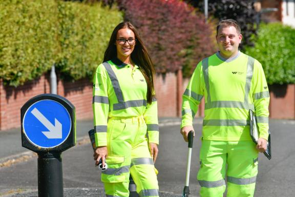 two of our highways apprentices on the roadside in high vis