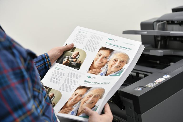 Printed documents being held