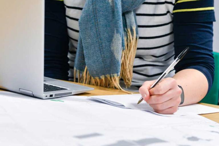 Woman planning at desk