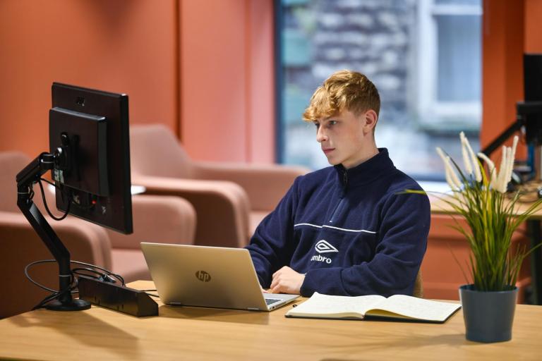 an apprentice working in the office