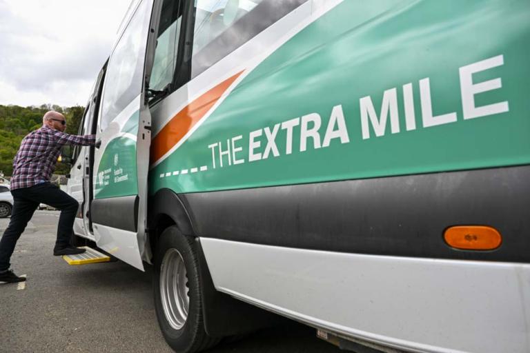 Vehicle with 'the extra mile' printed on the side
