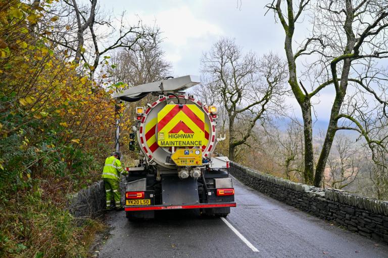 Highways maintenance vehicle on the side of the road